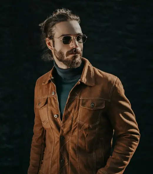 Man in a tan suede jacket